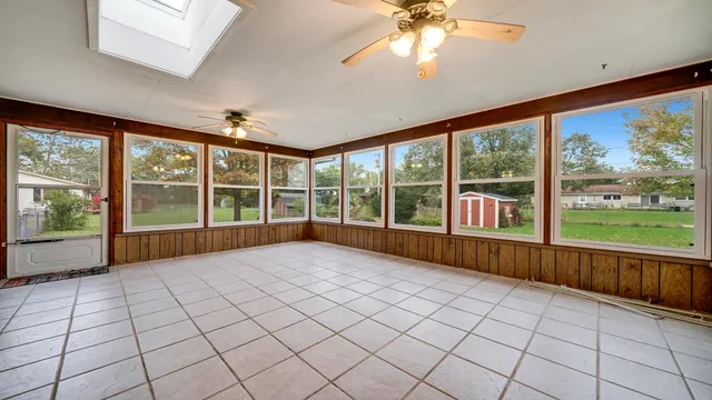 a view of an empty room with a window