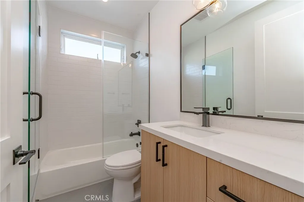 614 North Rampart Boulevard, Unit 1/2 Silver Lake, CA 90026 - Photo 24 of 41 a bathroom with a sink a toilet and shower