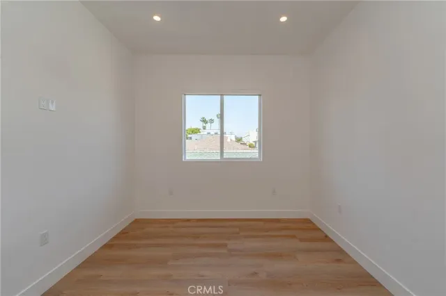 an empty room with closet area