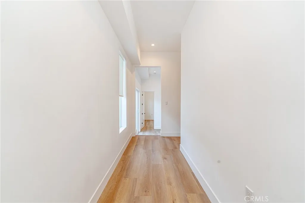 614 North Rampart Boulevard, Unit 1/2 Silver Lake, CA 90026 - Photo 8 of 41 a view of a hallway with wooden floor