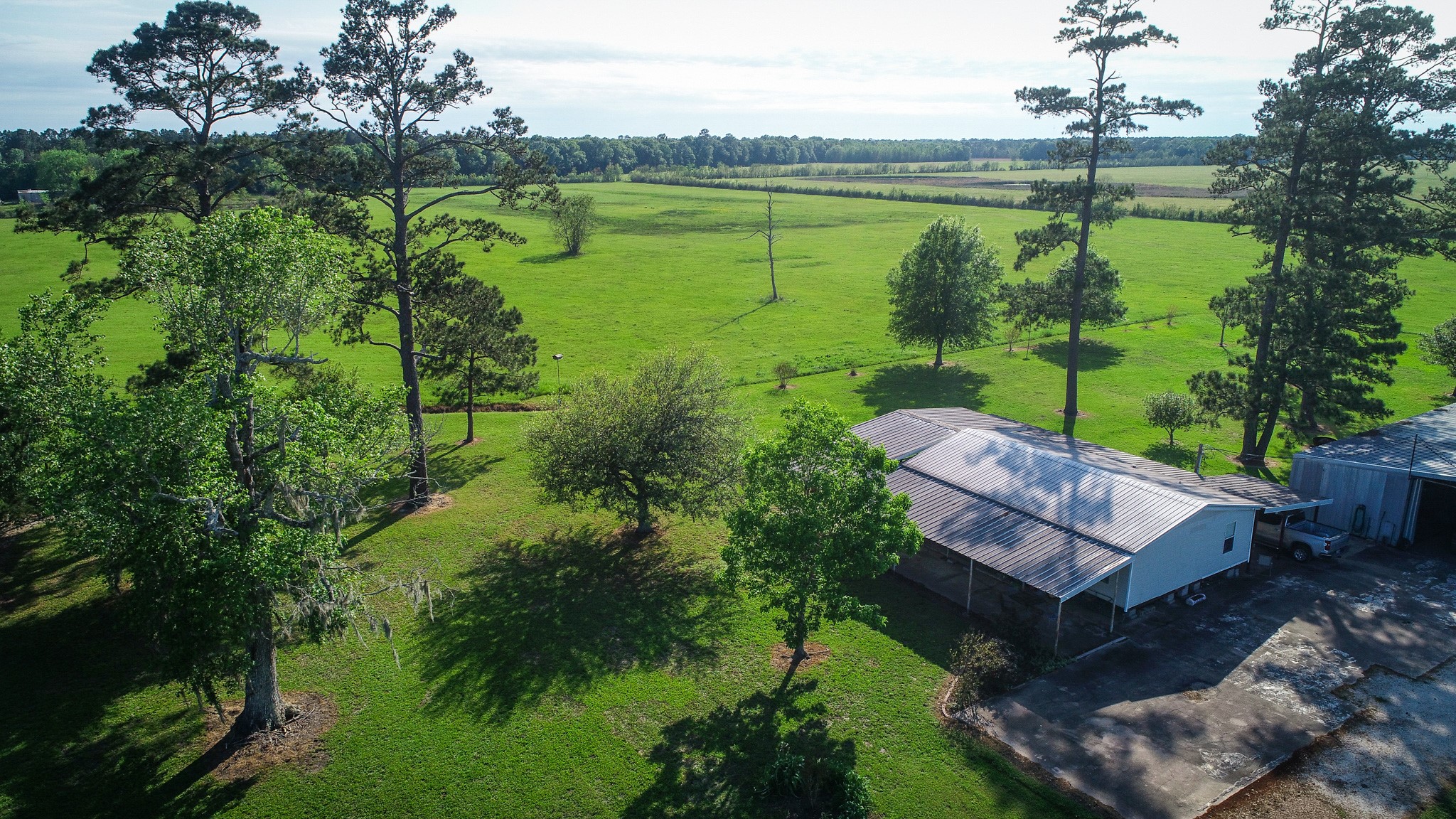 40902 Highway 105 Batson, TX 77519 - Photo 25 of 50 a view of a lake with a house in the background