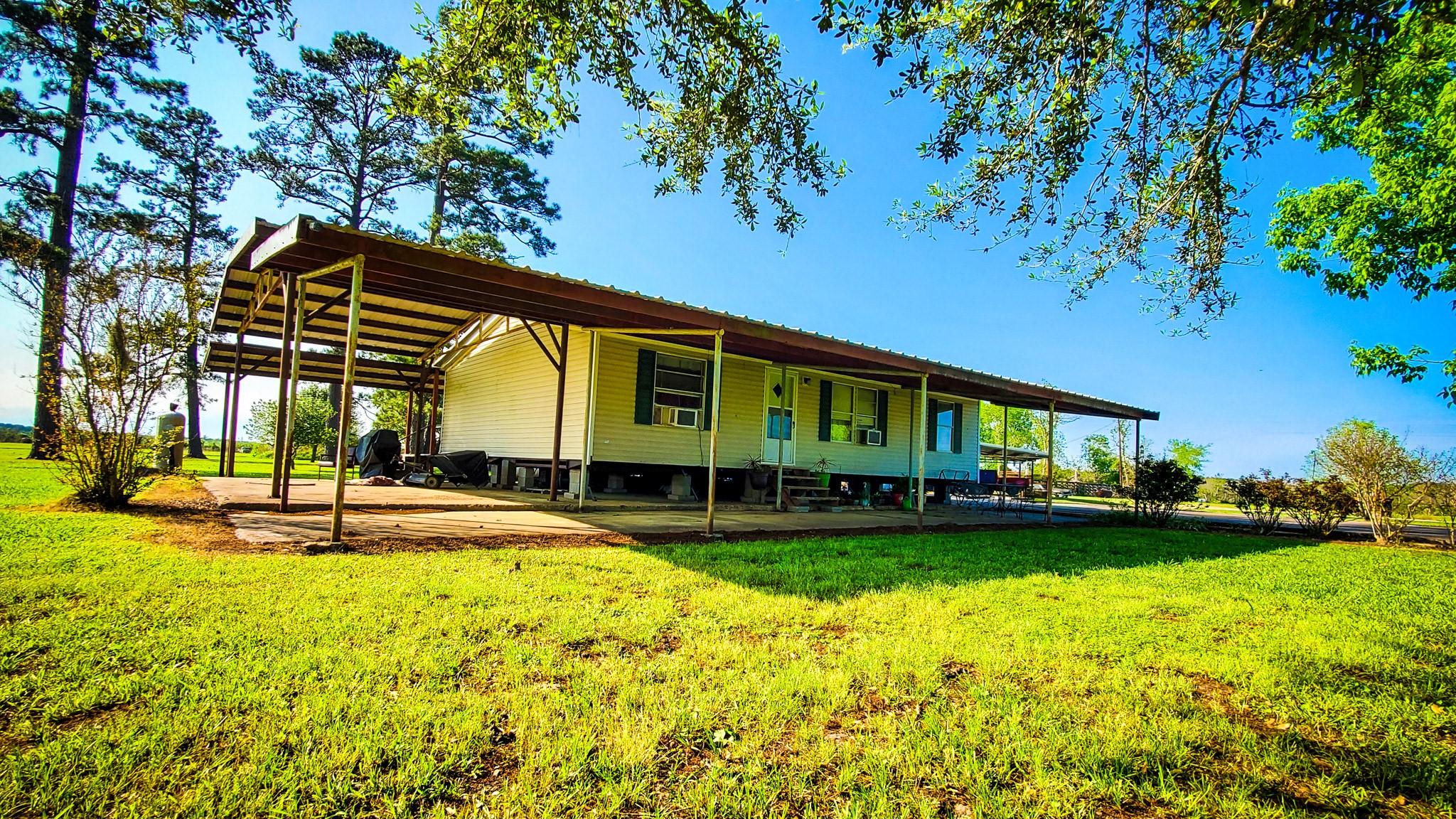 40902 Highway 105 Batson, TX 77519 - Photo 28 of 50 a view of swimming pool with lawn chairs and plants