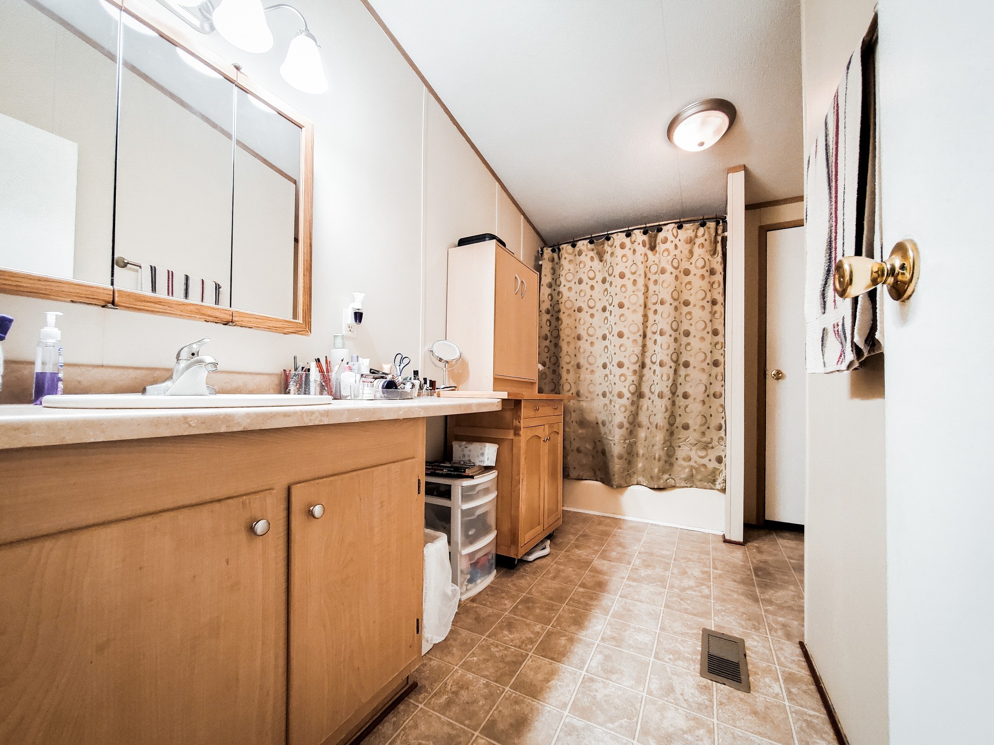 40902 Highway 105 Batson, TX 77519 - Photo 39 of 50 a bathroom with a sink mirror and a shower