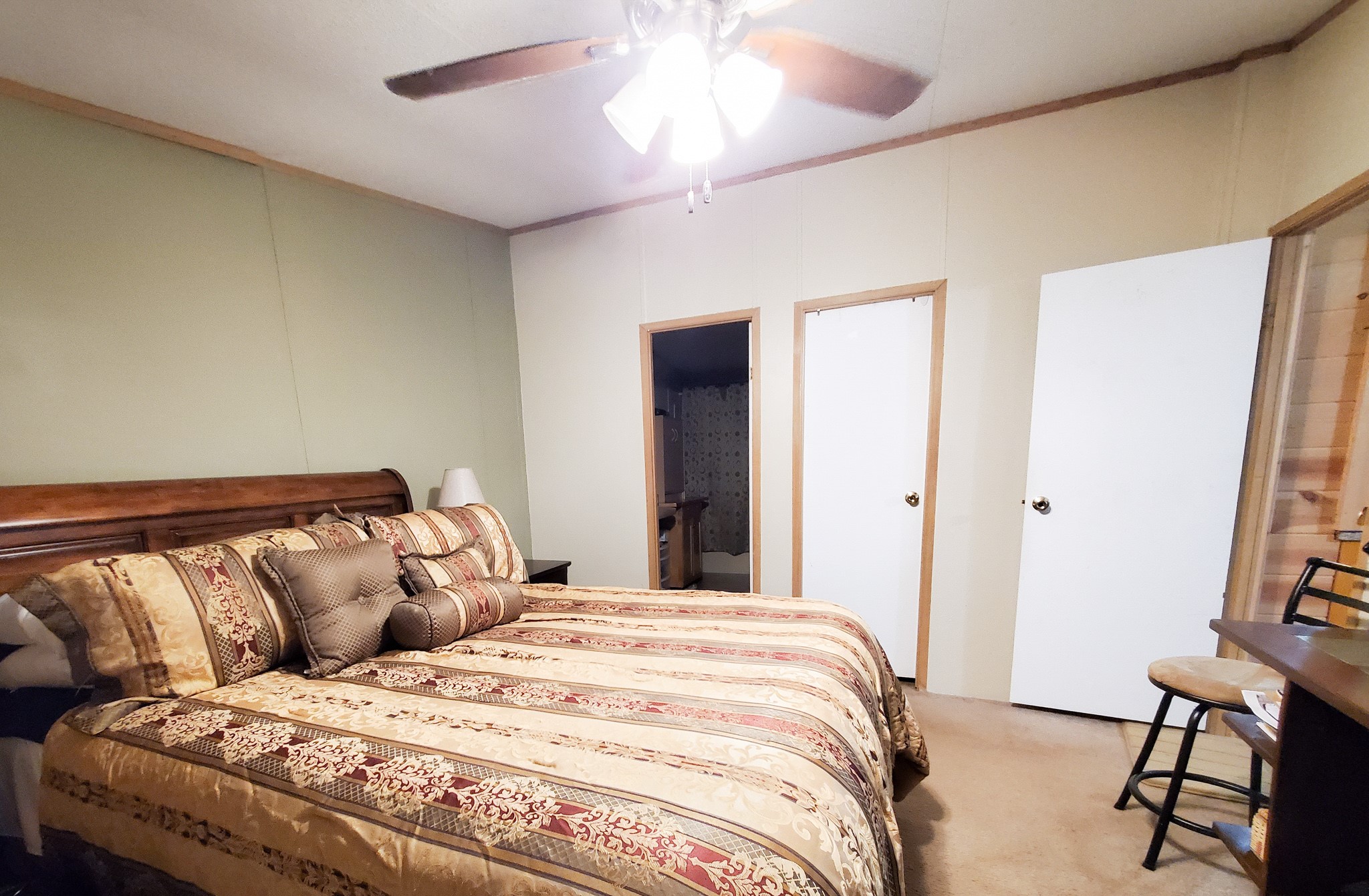 40902 Highway 105 Batson, TX 77519 - Photo 40 of 50 a bedroom with a bed and a chandelier
