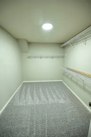 a large kitchen with stainless steel appliances granite countertop a stove and a sink