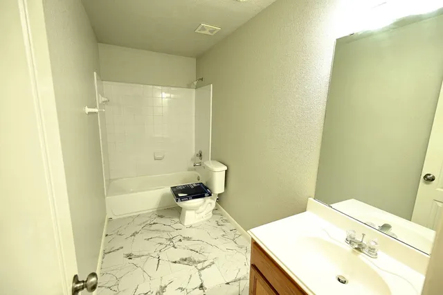 an empty room with a mirror