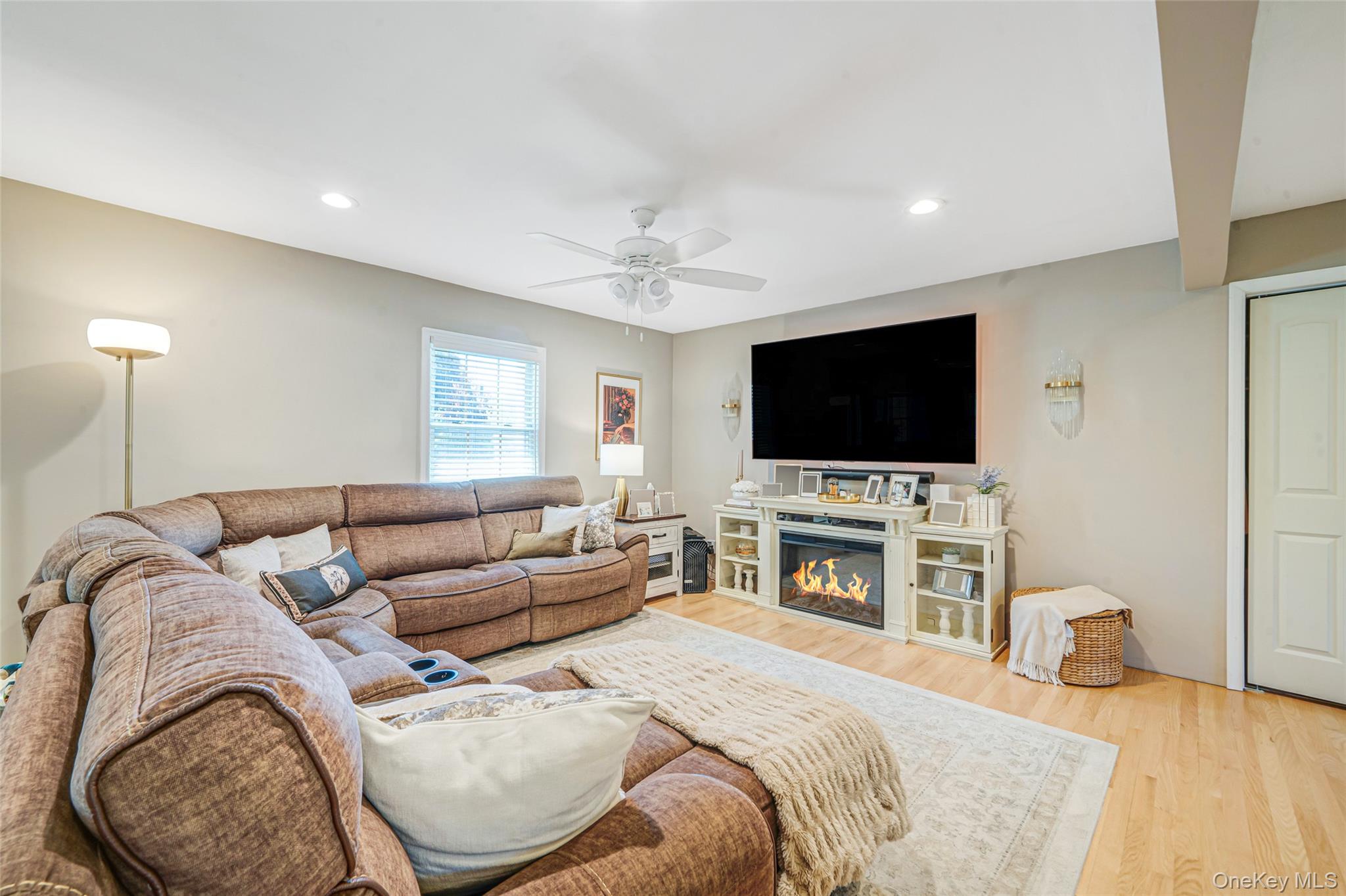 389 Yale Road Franklin Square, NY 11010 - Photo 11 of 43 a living room with furniture and a flat screen tv