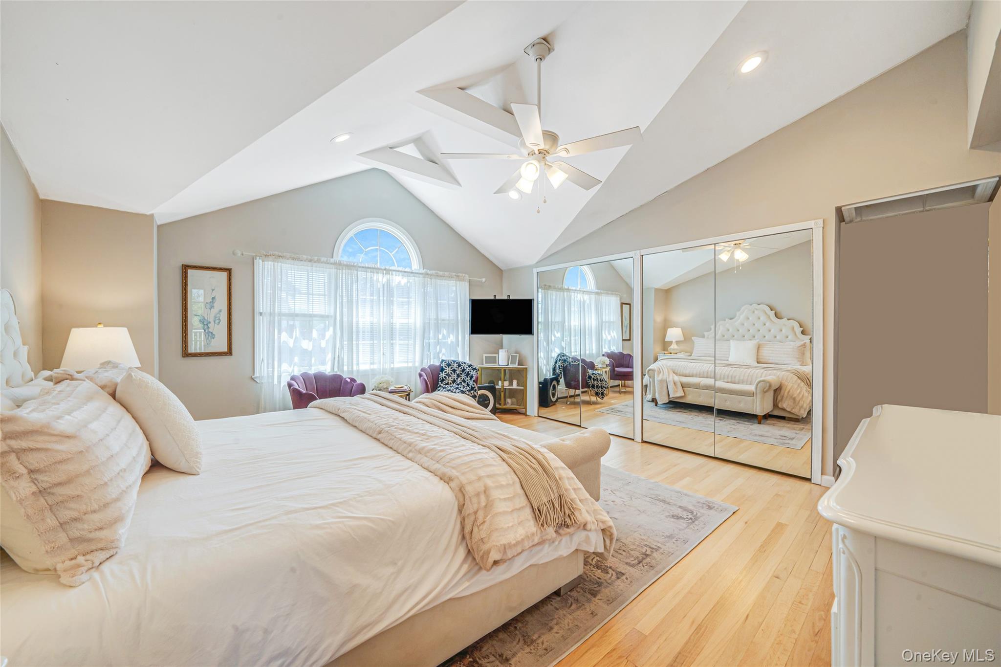 389 Yale Road Franklin Square, NY 11010 - Photo 27 of 43 a bedroom with a large bed and a large window