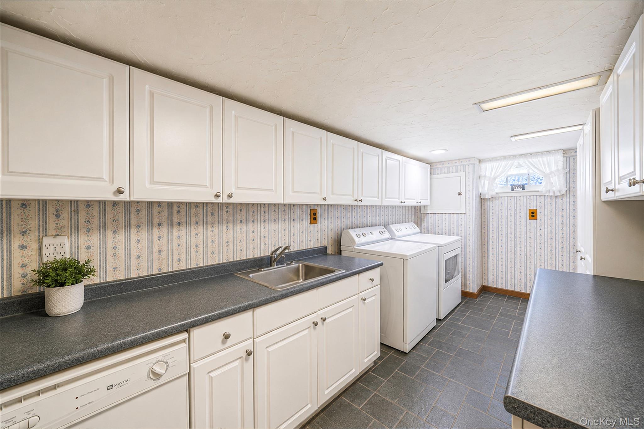 389 Yale Road Franklin Square, NY 11010 - Photo 35 of 43 a kitchen with a sink and cabinets