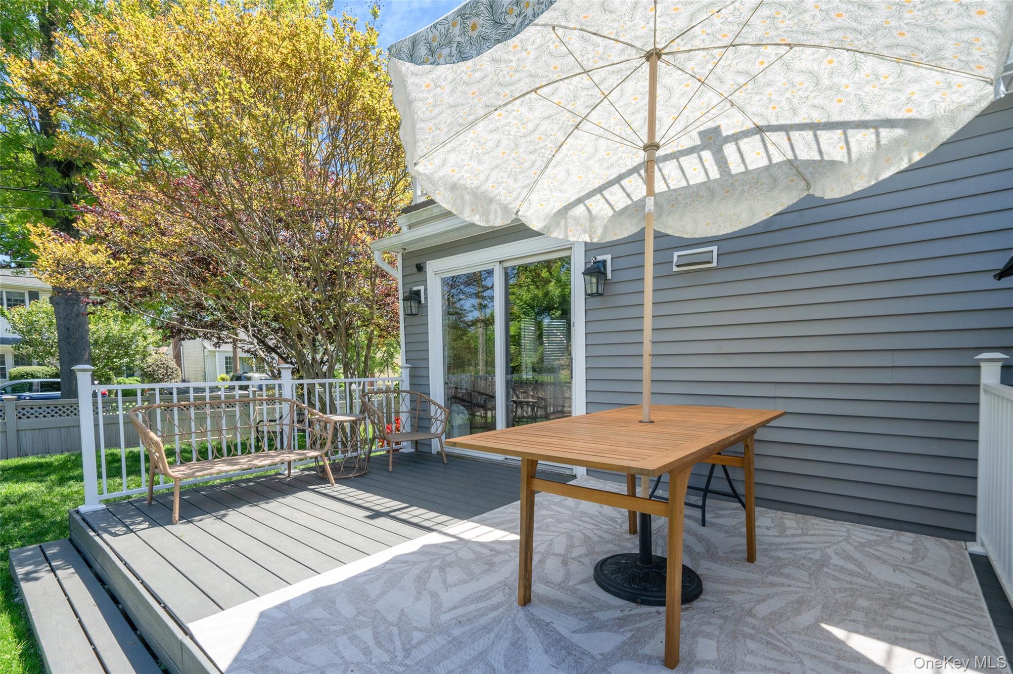 389 Yale Road Franklin Square, NY 11010 - Photo 39 of 43 a view of a patio with a table chairs and a potted plant