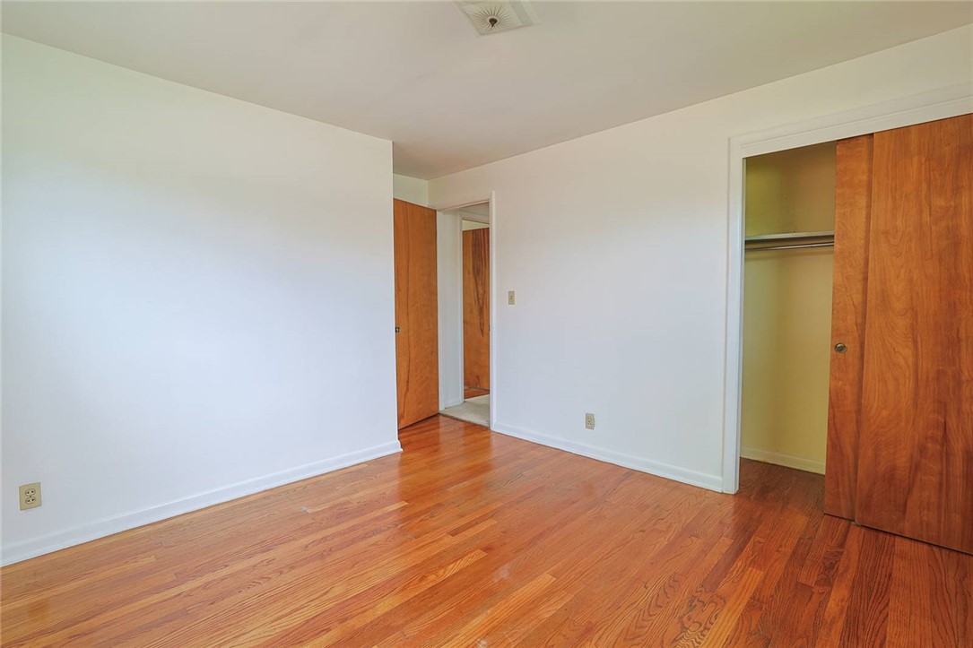 452 Cookston Avenue Springfield, OH 45503 - Photo 17 of 34 This cozy bedroom features polished hardwood flooring and convenient closet space.