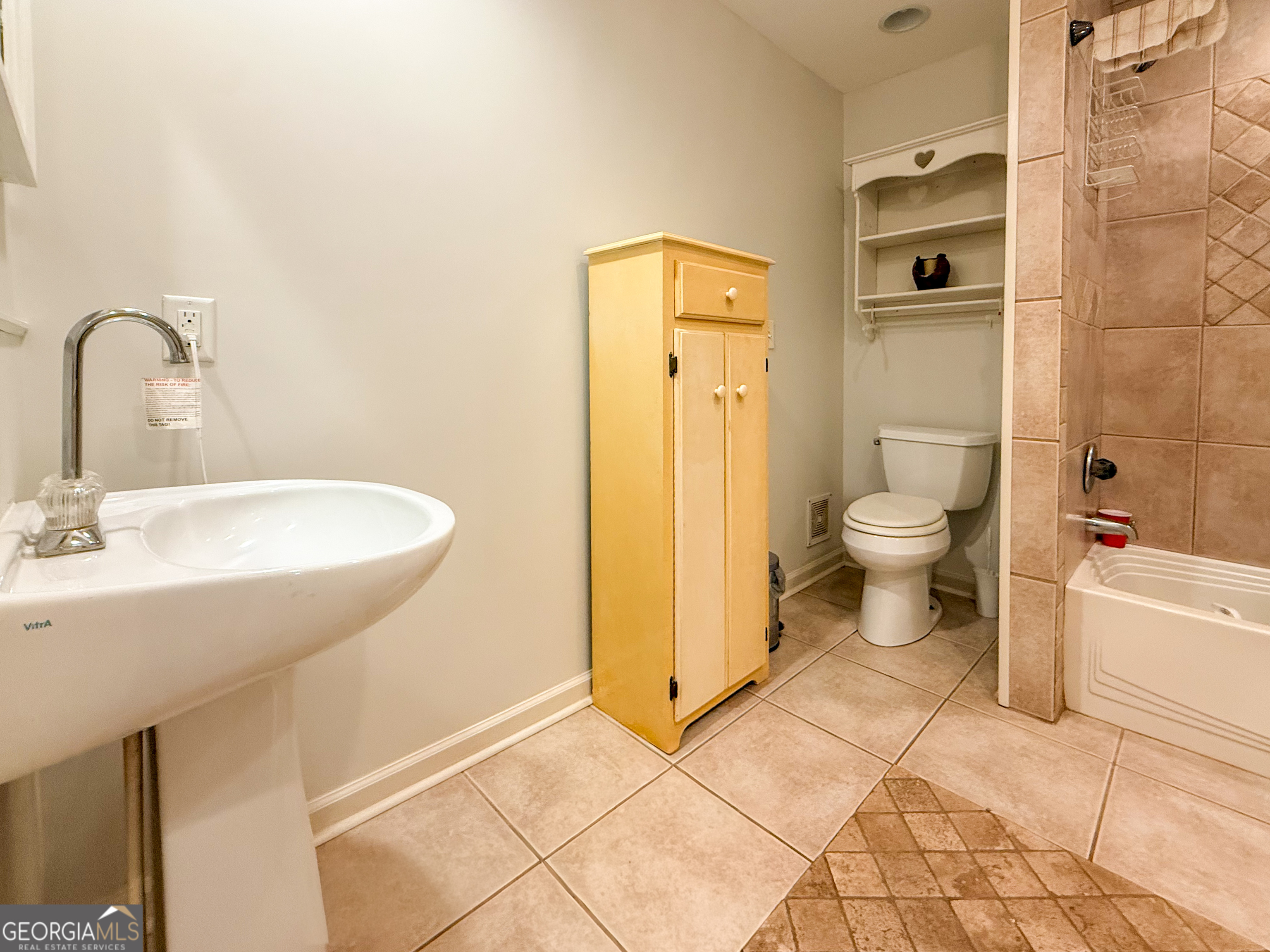 98 Canyon Pass Cleveland, GA 30528 - Photo 13 of 33 a bathroom with a sink a toilet and shower