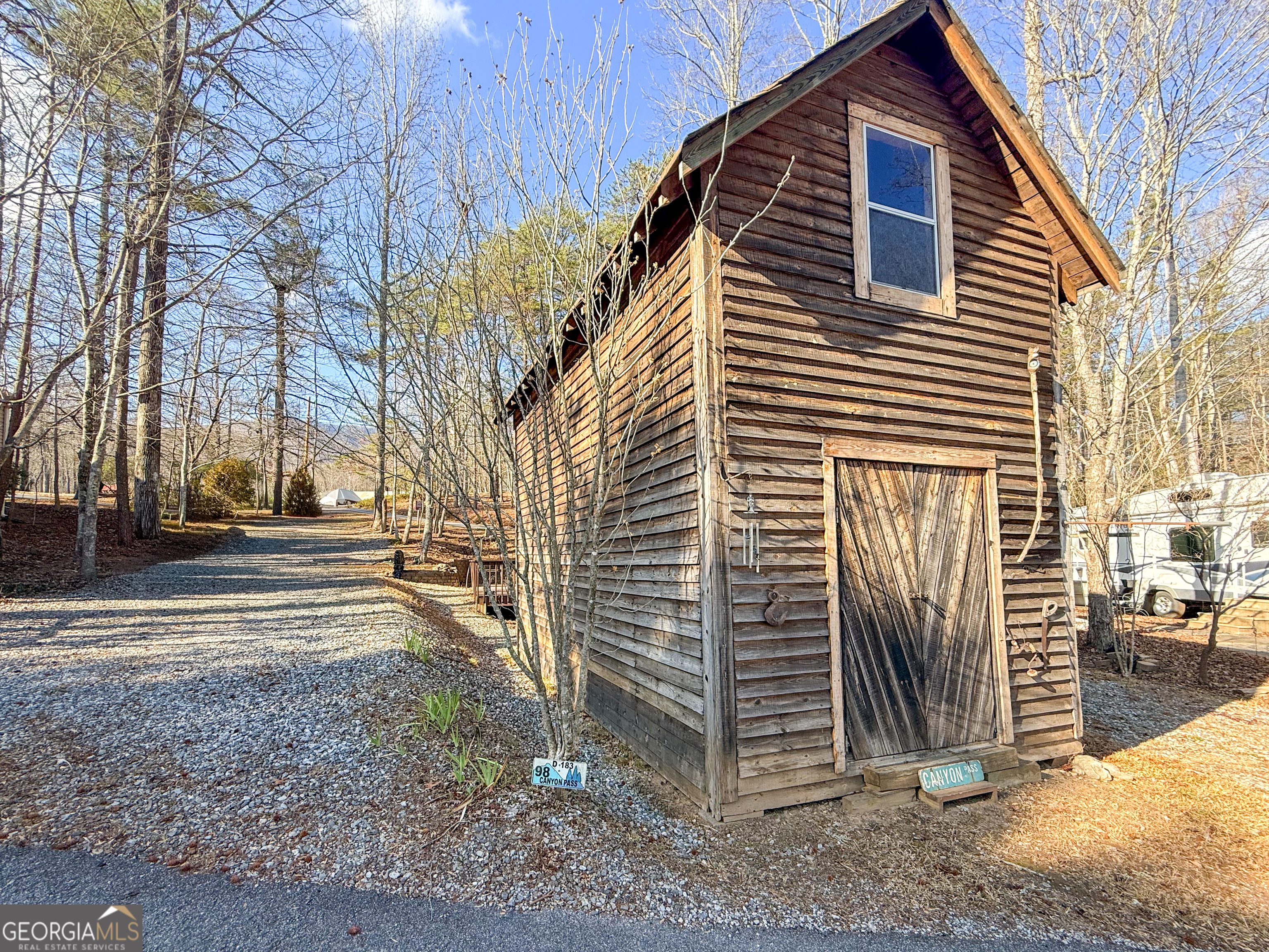 98 Canyon Pass Cleveland, GA 30528 - Photo 22 of 33 a view of a house with a yard