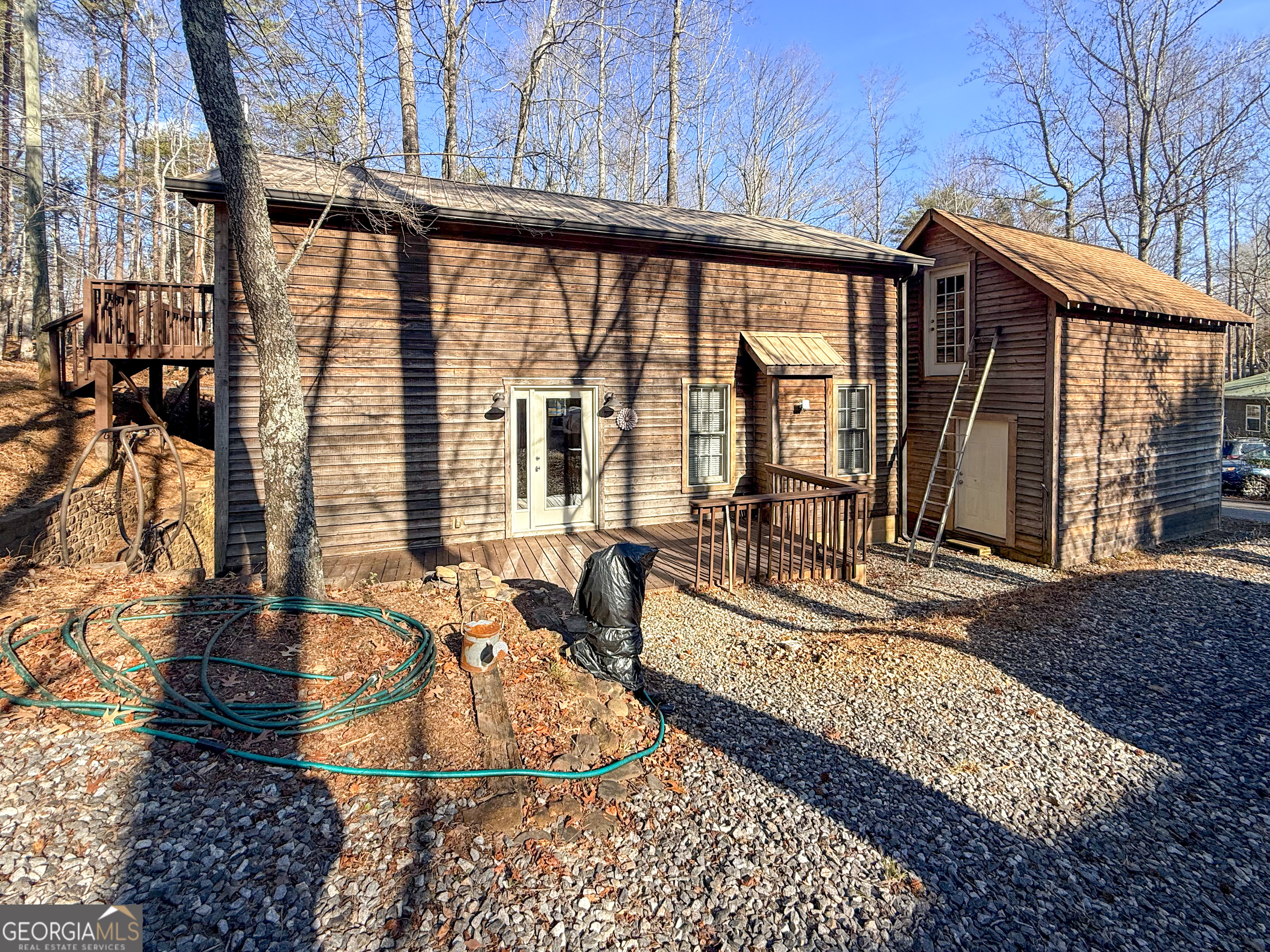 98 Canyon Pass Cleveland, GA 30528 - Photo 24 of 33 a view of a patio with couches chairs and wooden floor