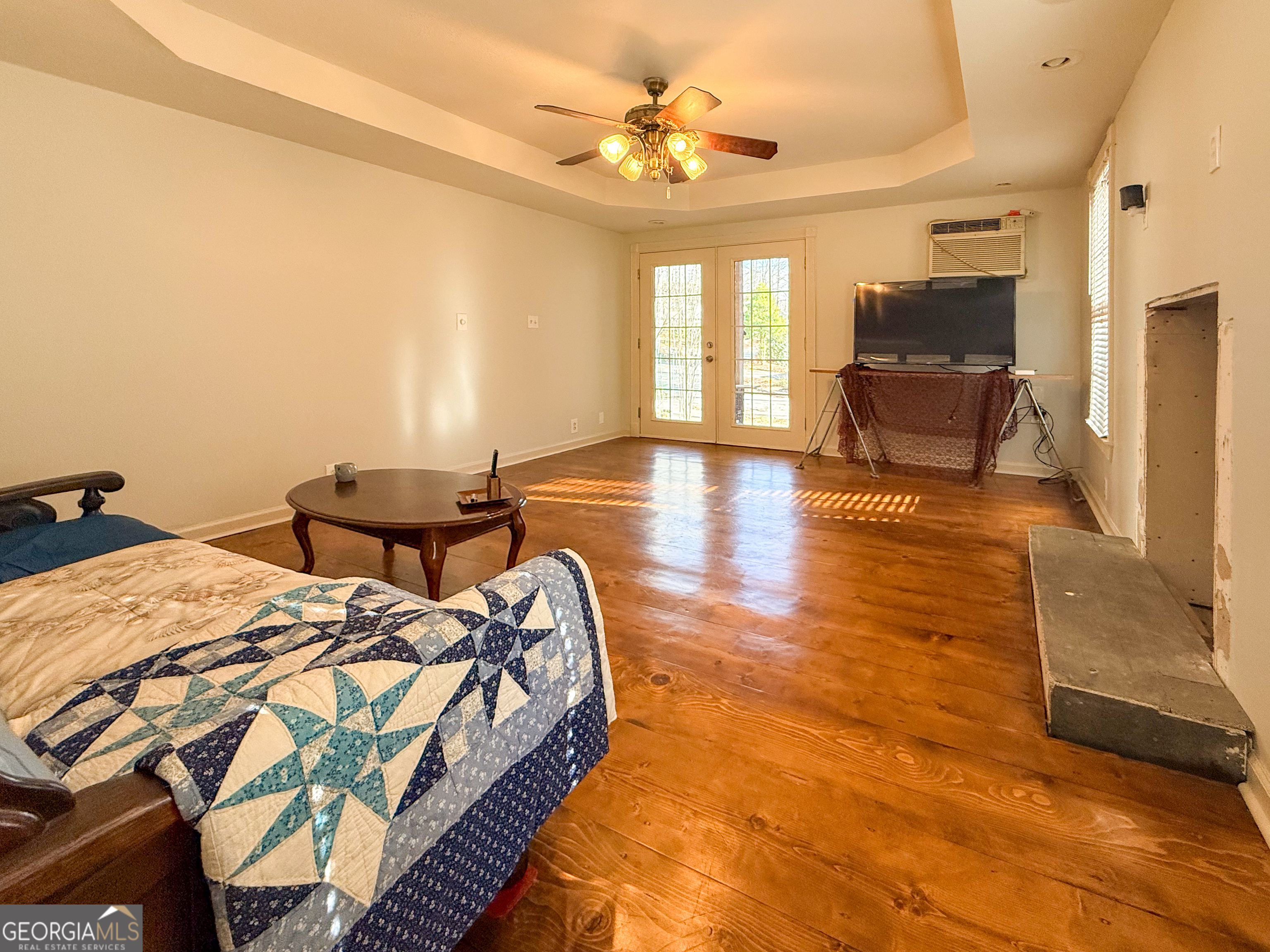 98 Canyon Pass Cleveland, GA 30528 - Photo 6 of 33 a bed sitting in a spacious bedroom next to a window