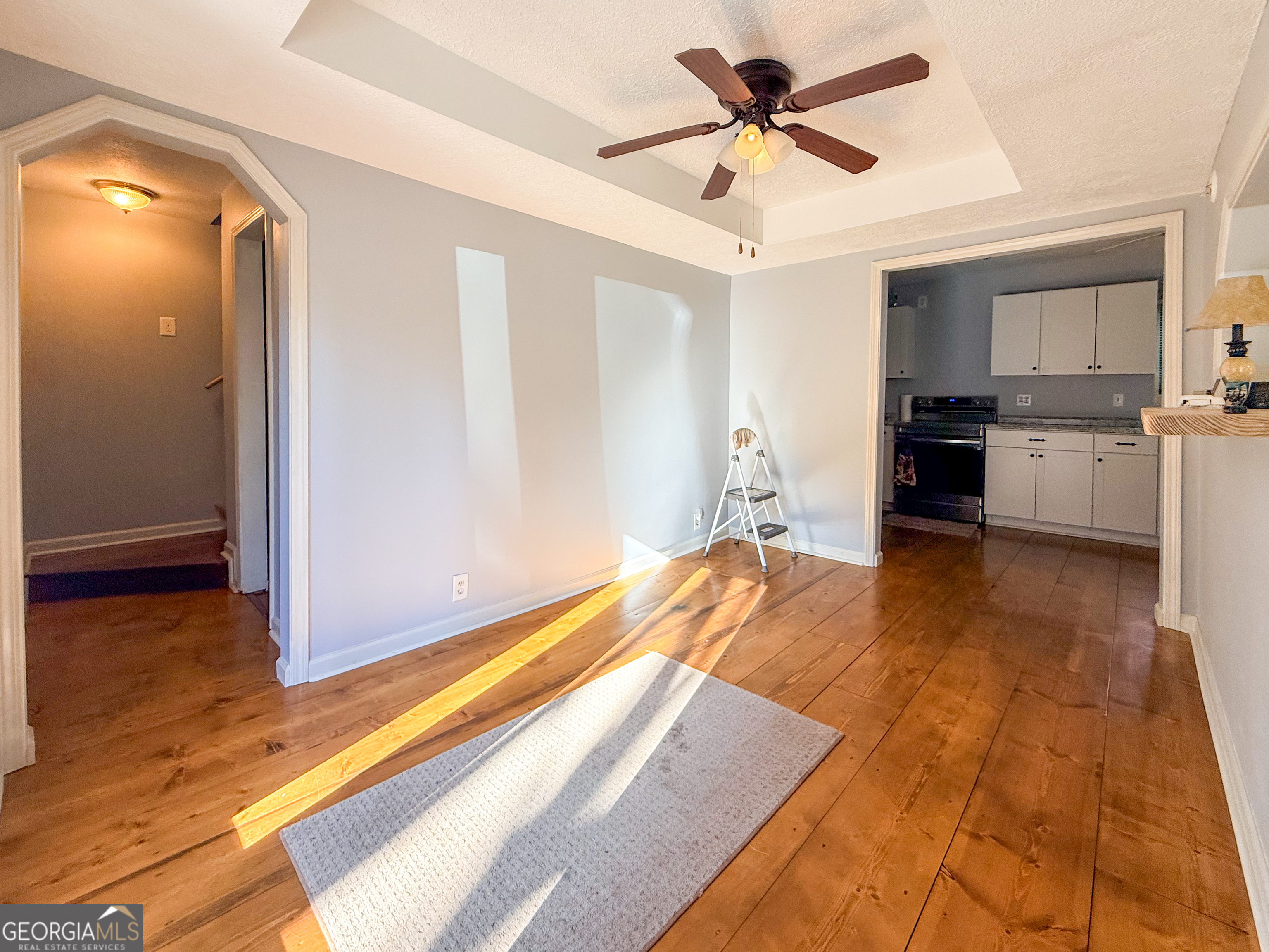 98 Canyon Pass Cleveland, GA 30528 - Photo 7 of 33 a bedroom with a bed and a view of kitchen