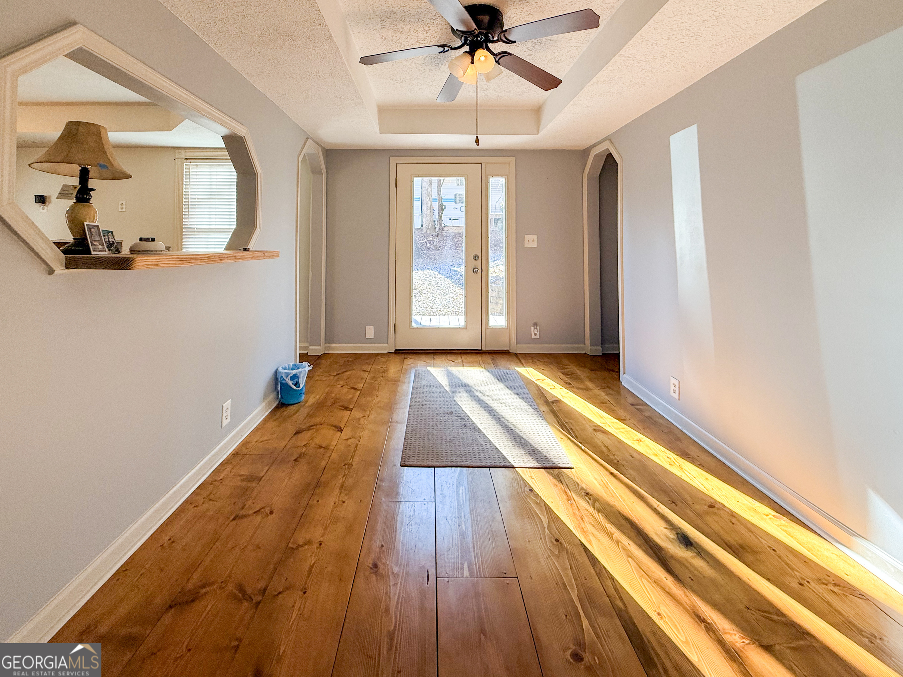 98 Canyon Pass Cleveland, GA 30528 - Photo 8 of 33 a view of a room with wooden floor and chandelier
