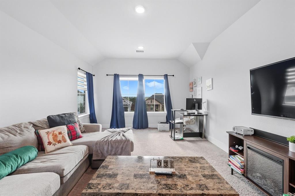 2470 Pebble Bank Lane Midlothian, TX 76065 - Photo 12 of 33 a living room with furniture and a flat screen tv