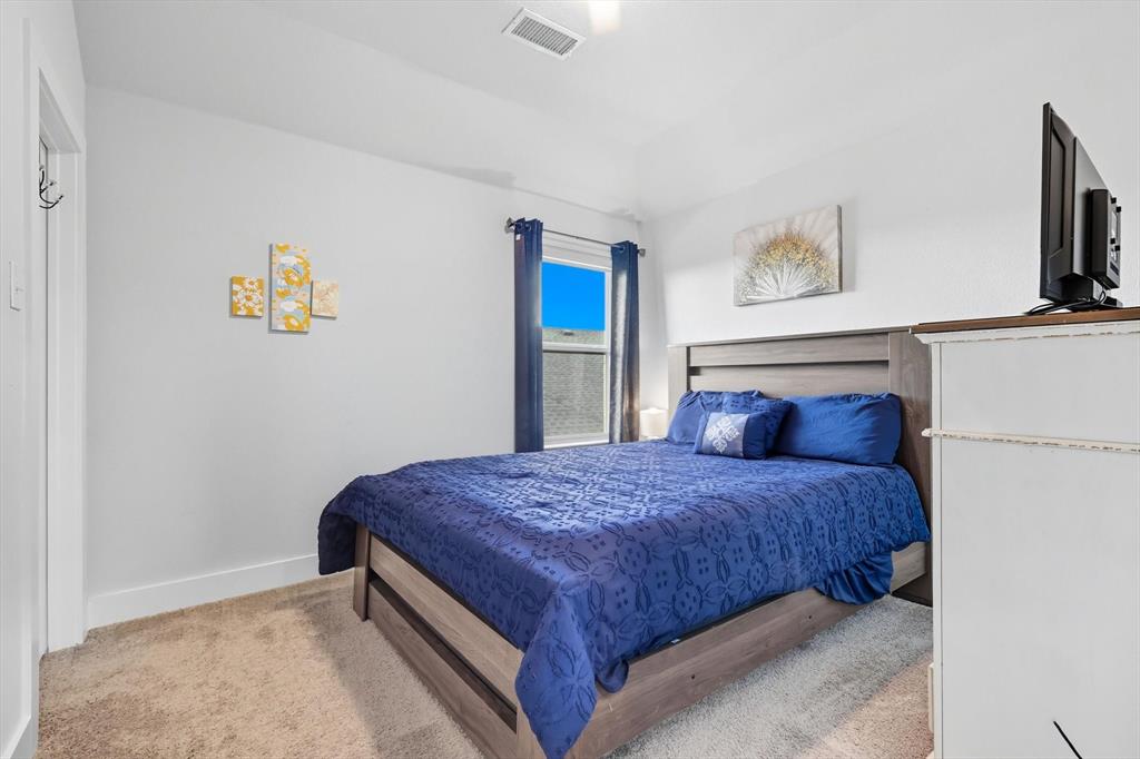 2470 Pebble Bank Lane Midlothian, TX 76065 - Photo 15 of 33 a bedroom with a bed and painting on the wall