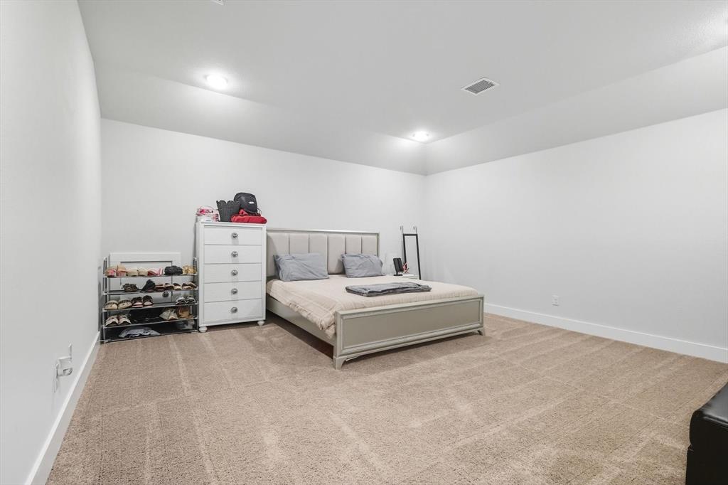 2470 Pebble Bank Lane Midlothian, TX 76065 - Photo 17 of 33 a bedroom with a bed and a dresser