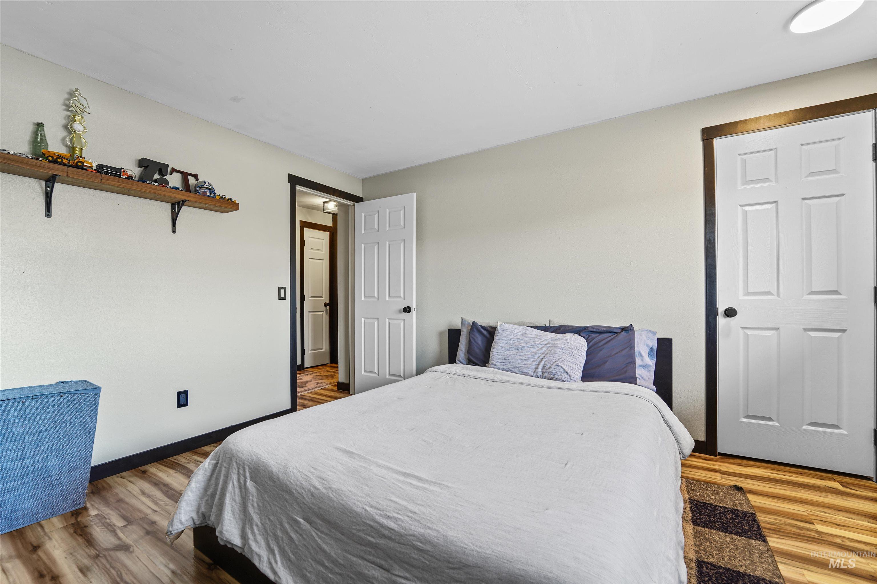 348 North Eagle Road Eagle, ID 83616 - Photo 16 of 31 Bedroom with wood finished floors and baseboards