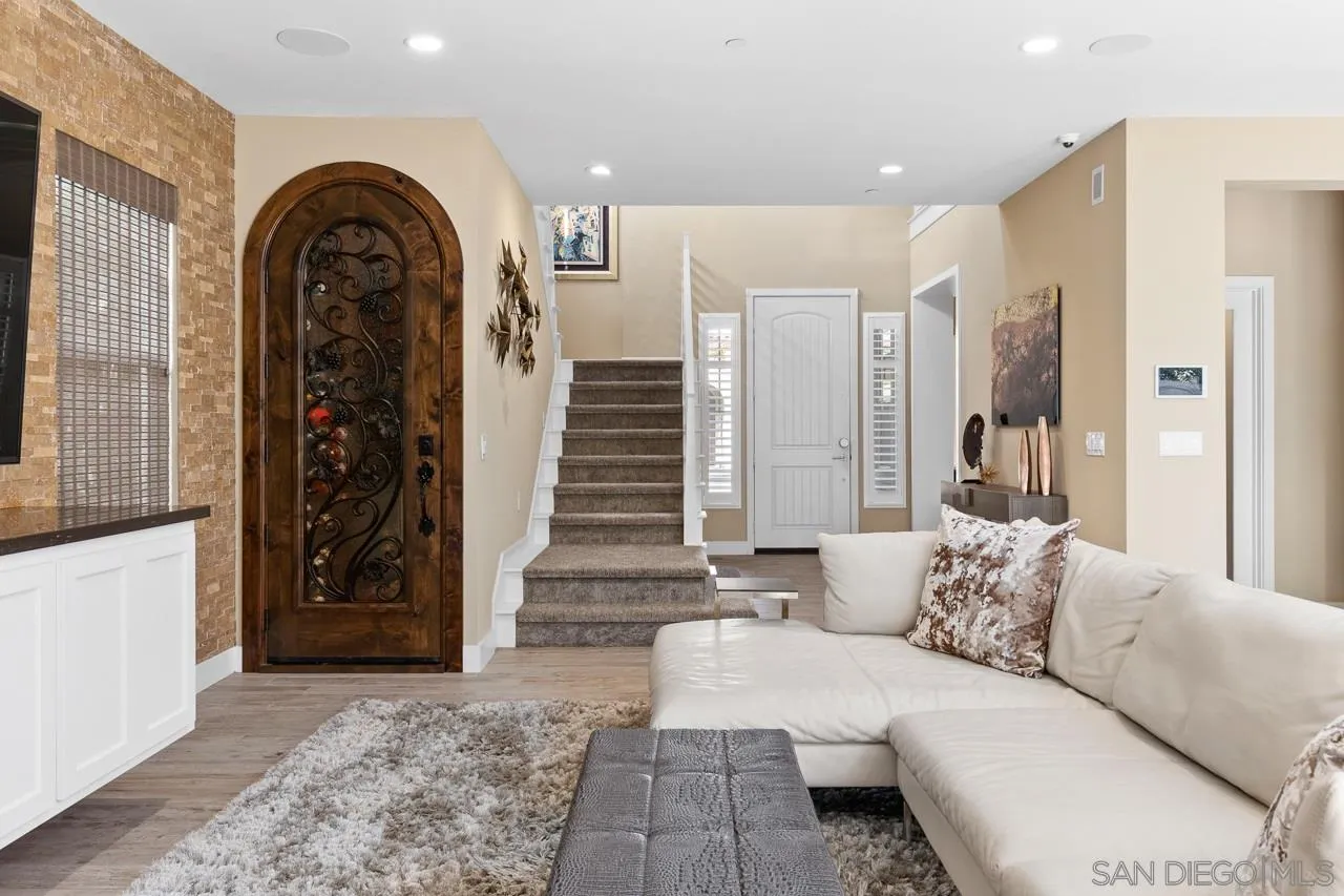 207 Stonesteps Way Encinitas, CA 92024 - Photo 11 of 34 a living room with furniture and outdoor space