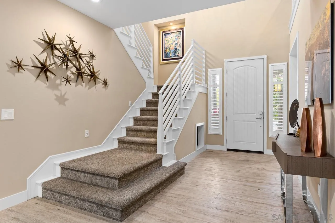 207 Stonesteps Way Encinitas, CA 92024 - Photo 13 of 34 a view of entryway and hall with wooden floor