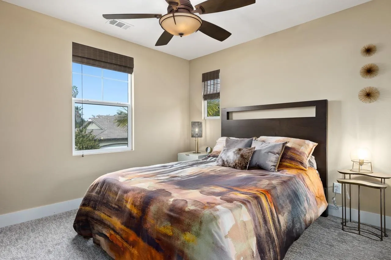 207 Stonesteps Way Encinitas, CA 92024 - Photo 20 of 34 a bedroom with a large bed and a window