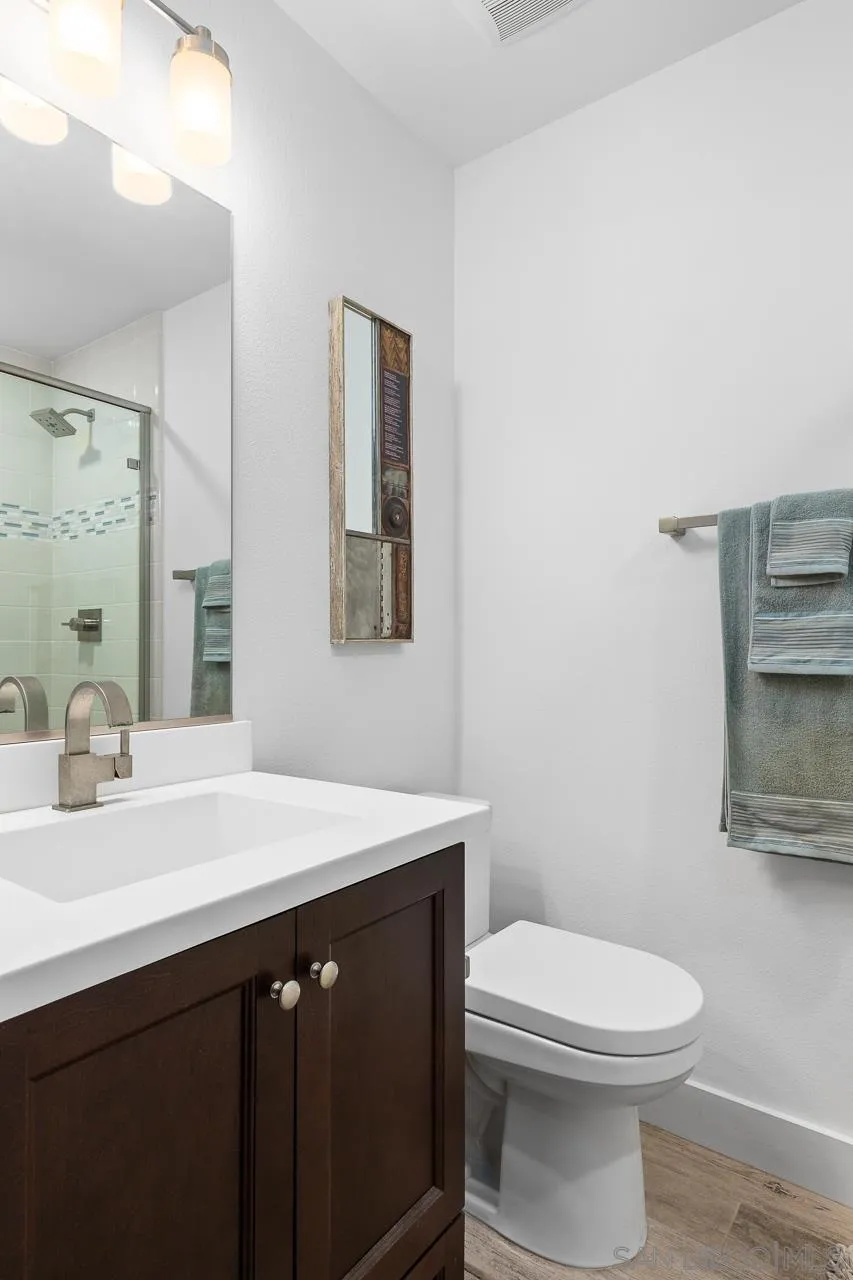 207 Stonesteps Way Encinitas, CA 92024 - Photo 21 of 34 a bathroom with a sink a toilet and mirror