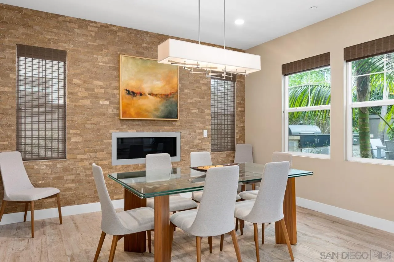 207 Stonesteps Way Encinitas, CA 92024 - Photo 9 of 34 a view of a dining room with furniture window and wooden floor