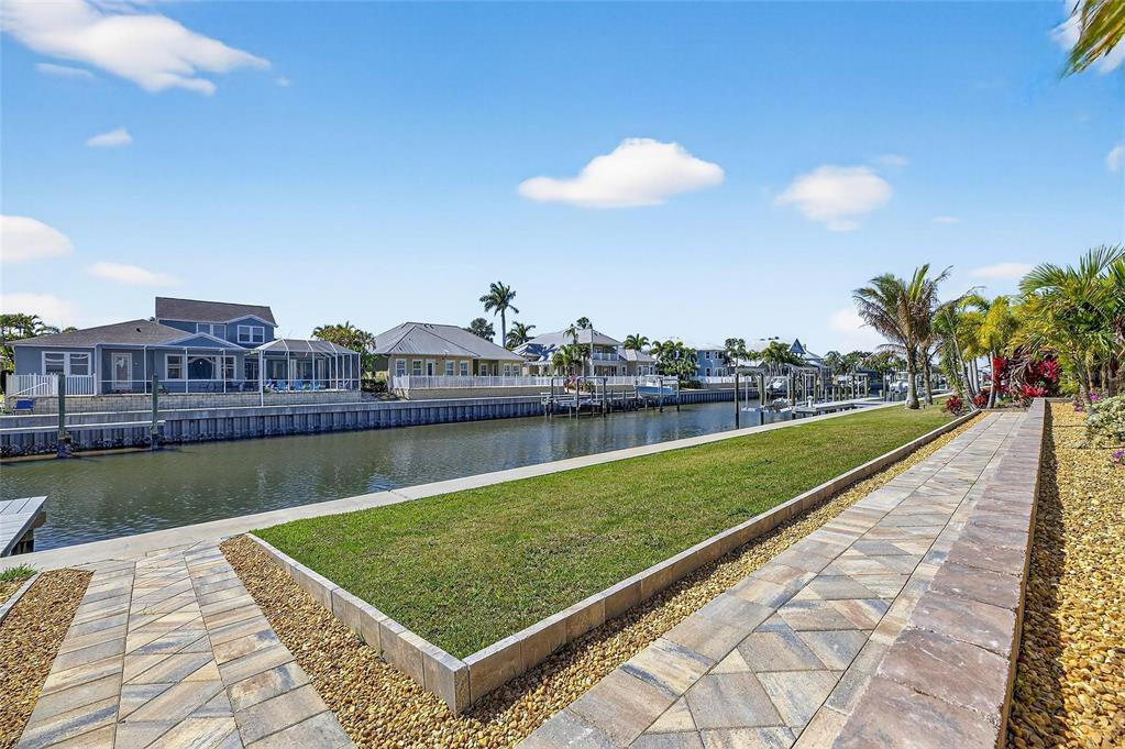 994 Signet Drive Apollo Beach, FL 33572 - Photo 64 of 98 a view of a swimming pool and a yard