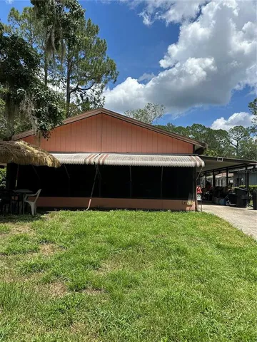 a backyard of a house with lots of green space