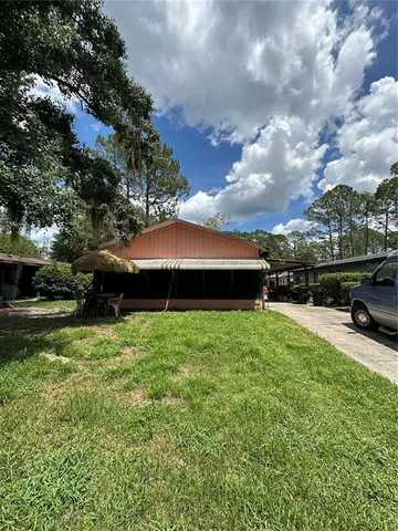 a backyard of a house with lots of green space