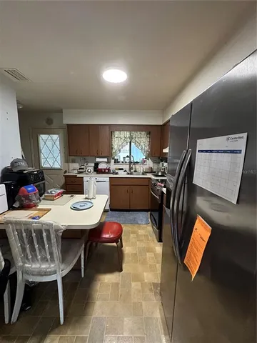 a outdoor space with furniture a rug and a window