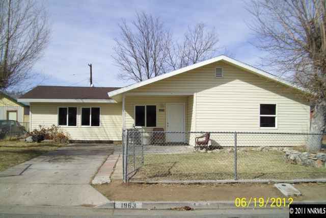 1963 Bishop Street Reno, NV 89512 - Photo 1 of 12 a front view of a house with garden