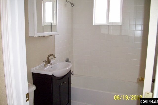 1963 Bishop Street Reno, NV 89512 - Photo 9 of 12 a bathroom with a sink and a mirror