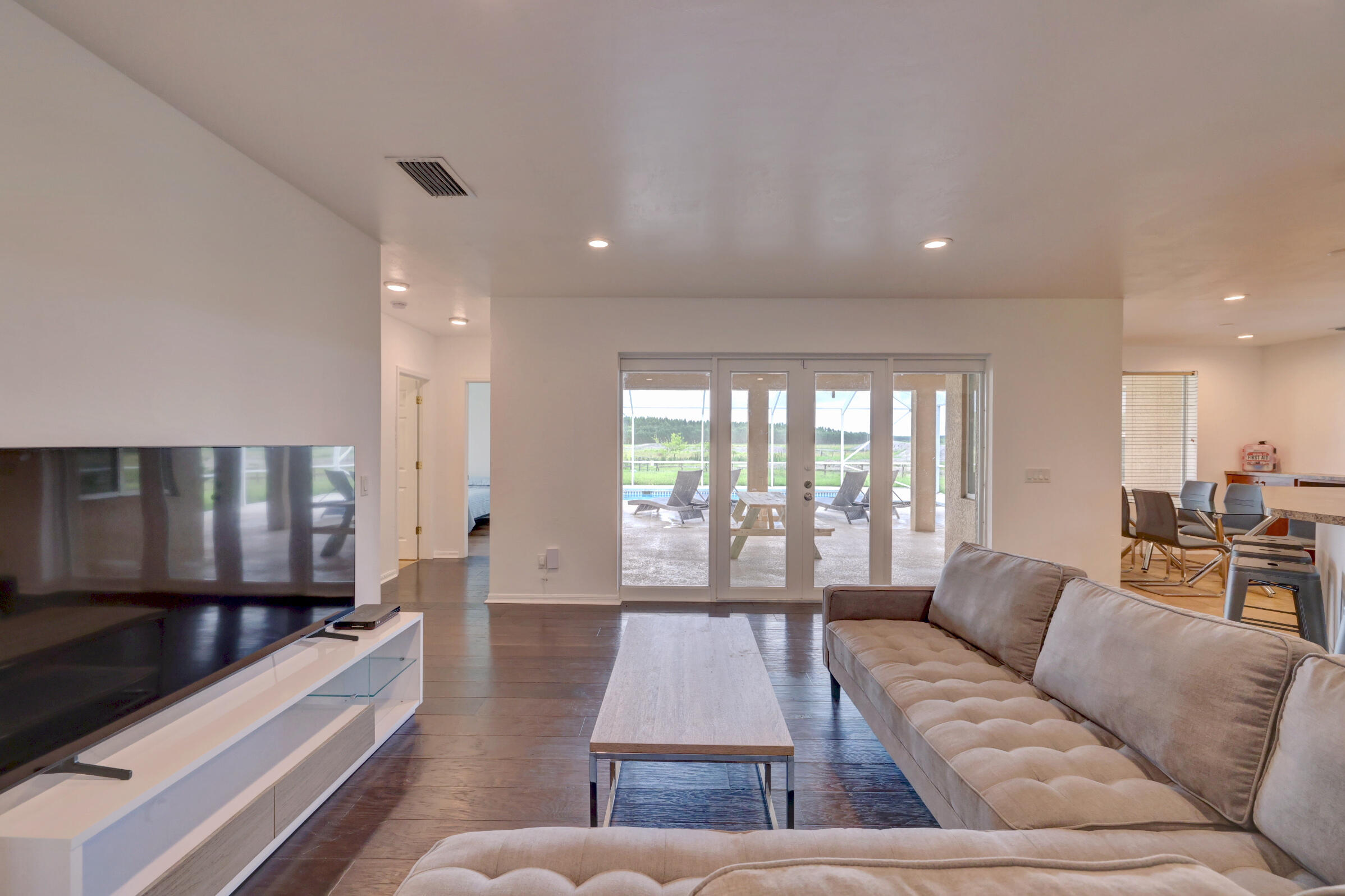 2700 South Header Canal Road Fort Pierce, FL 34945 - Photo 14 of 45 a living room with furniture and a large window