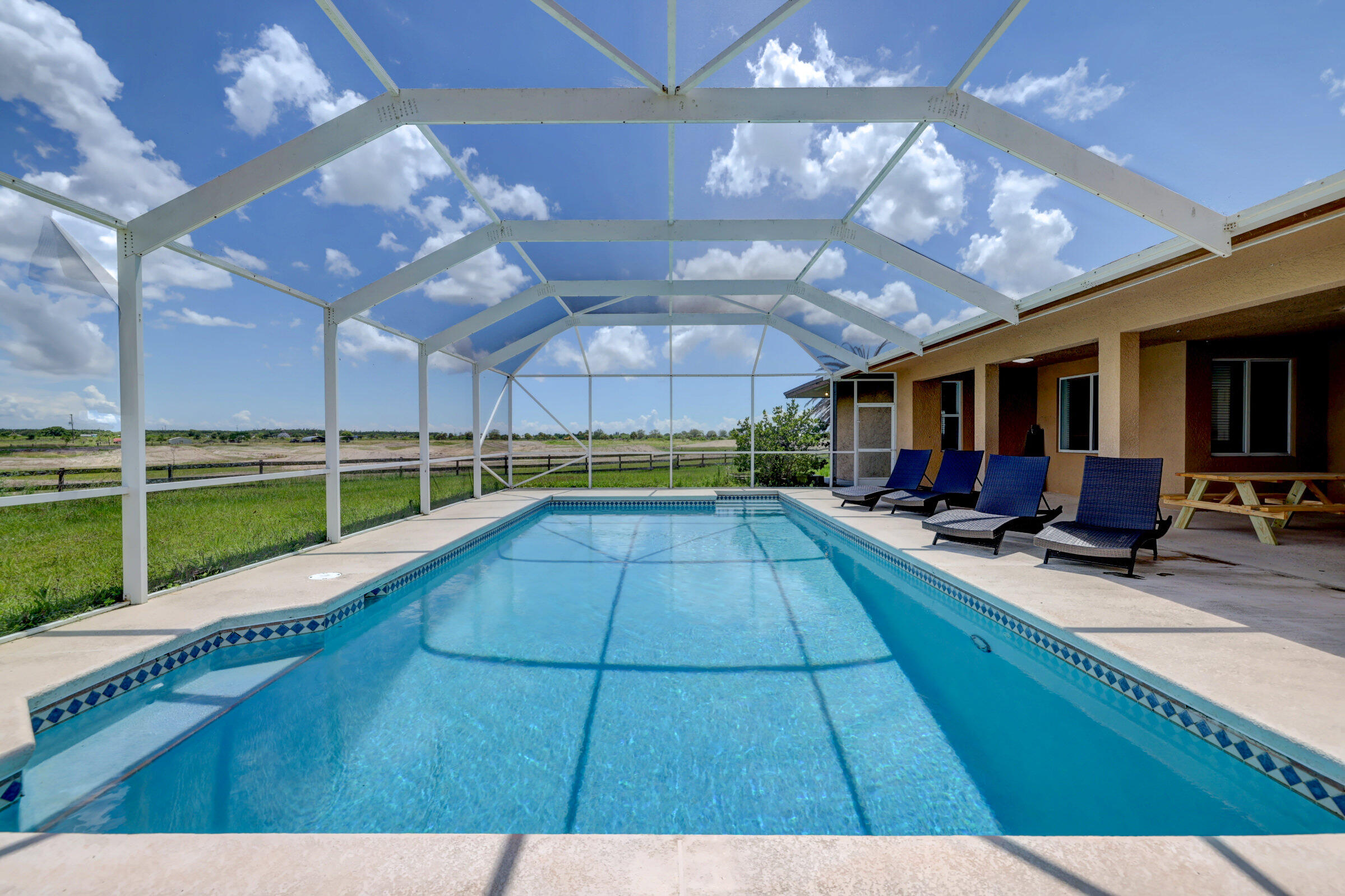2700 South Header Canal Road Fort Pierce, FL 34945 - Photo 4 of 45 a view of swimming pool with a patio
