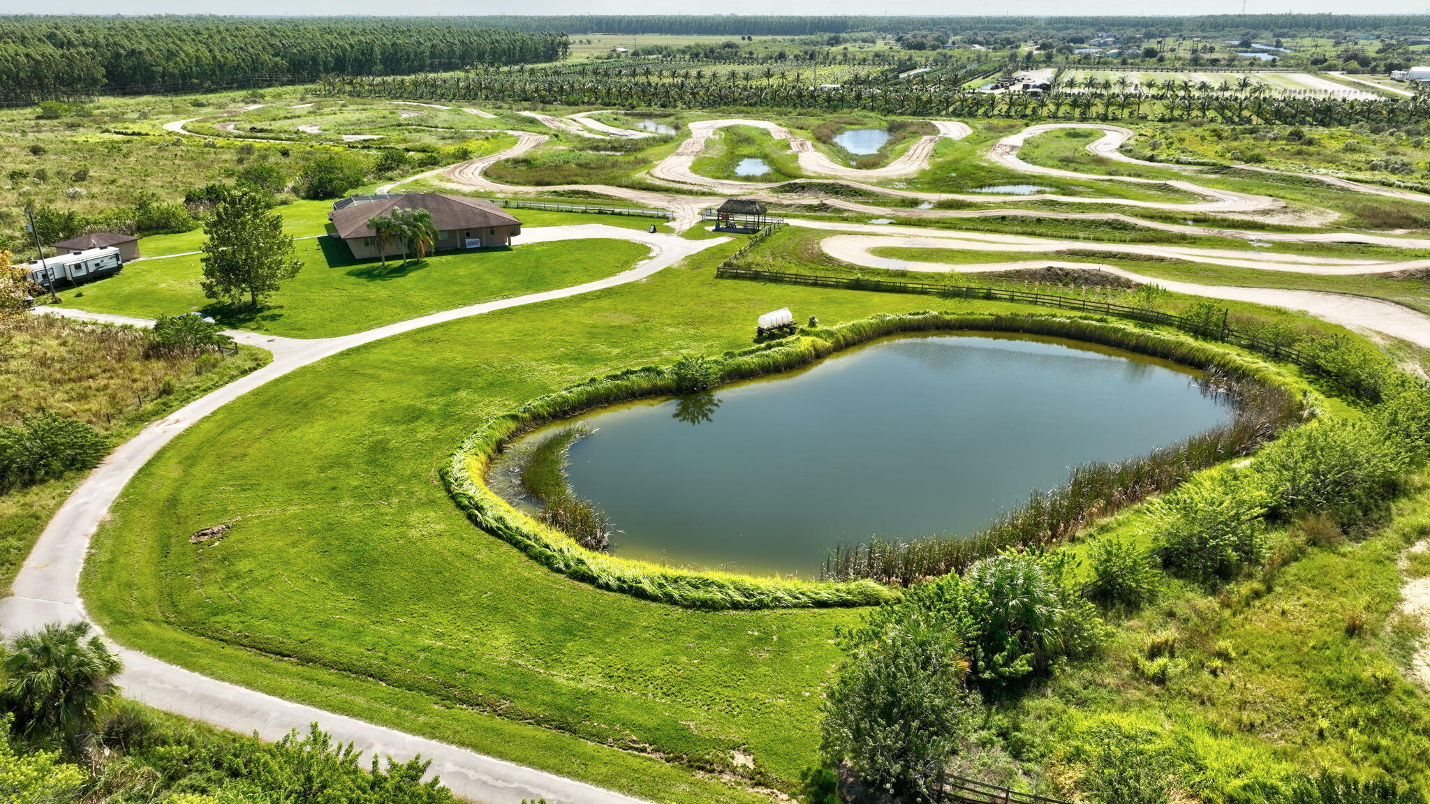 2700 South Header Canal Road Fort Pierce, FL 34945 - Photo 45 of 45 a view of a swimming pool and outdoor space