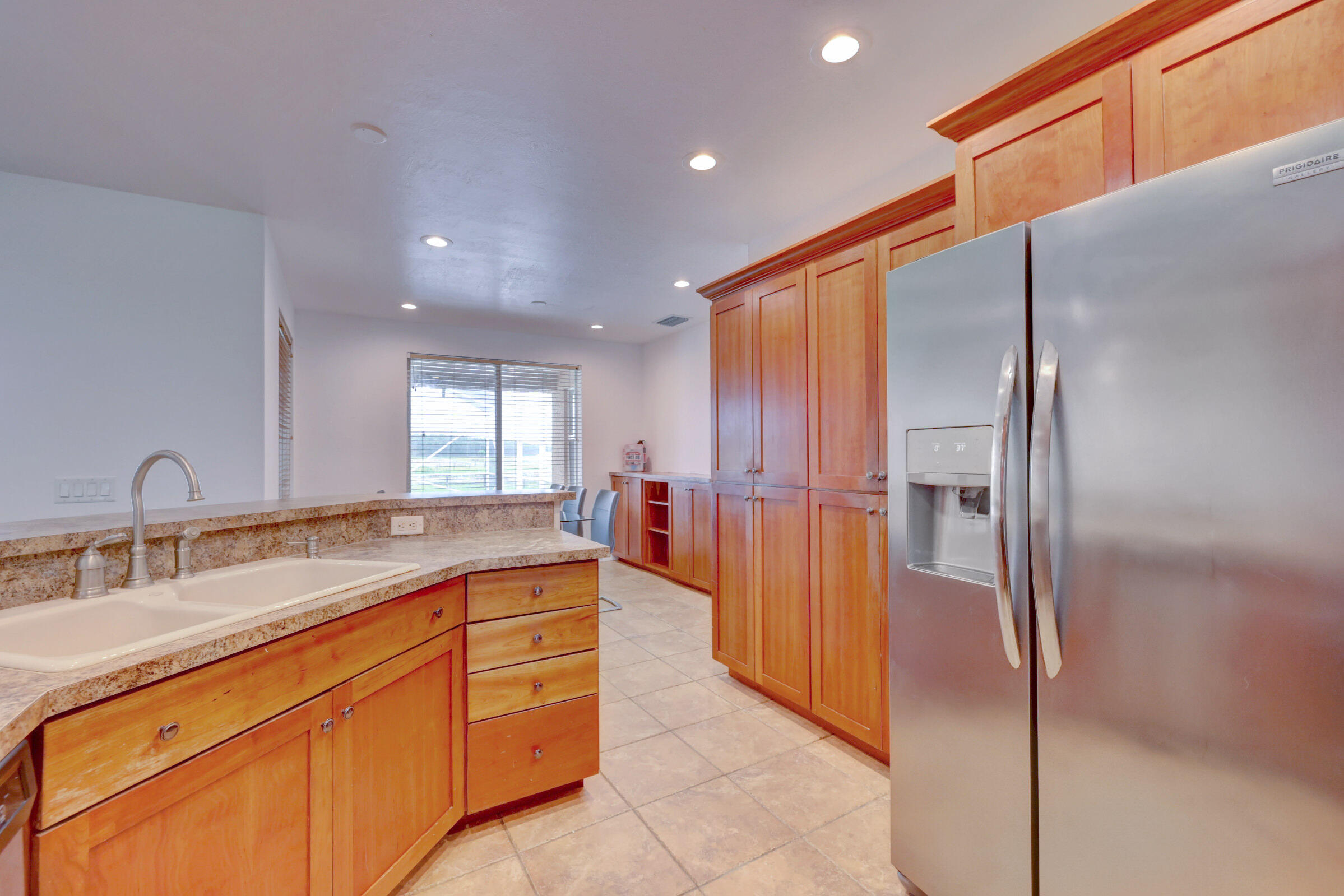 2700 South Header Canal Road Fort Pierce, FL 34945 - Photo 7 of 45 a spacious bathroom with a double vanity sink and a mirror