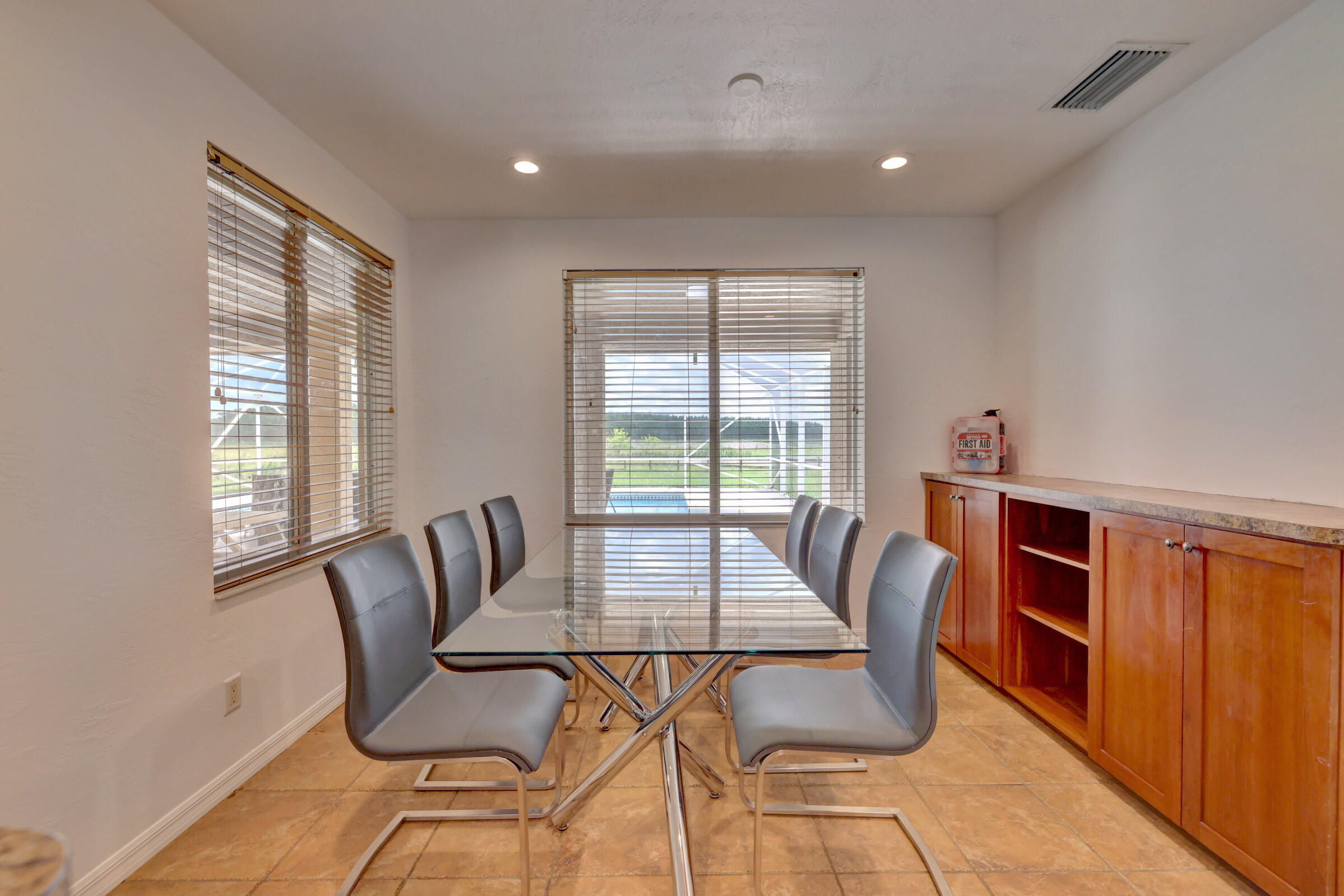 2700 South Header Canal Road Fort Pierce, FL 34945 - Photo 9 of 45 a view of a dining room with furniture and window