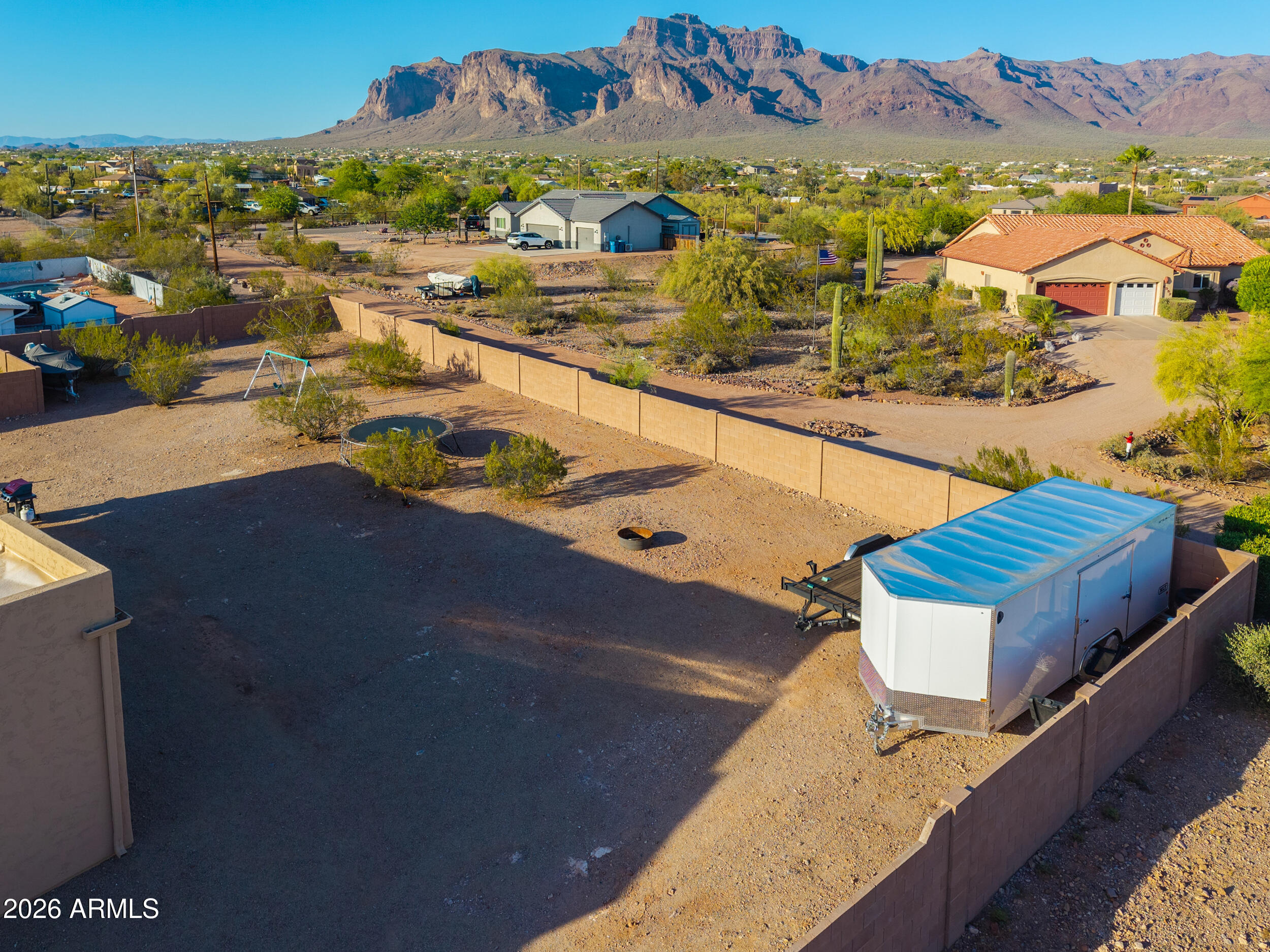 1487 South Mountain View Road Apache Junction, AZ 85119 - Photo 45 of 60 an aerial view of residential houses with outdoor space