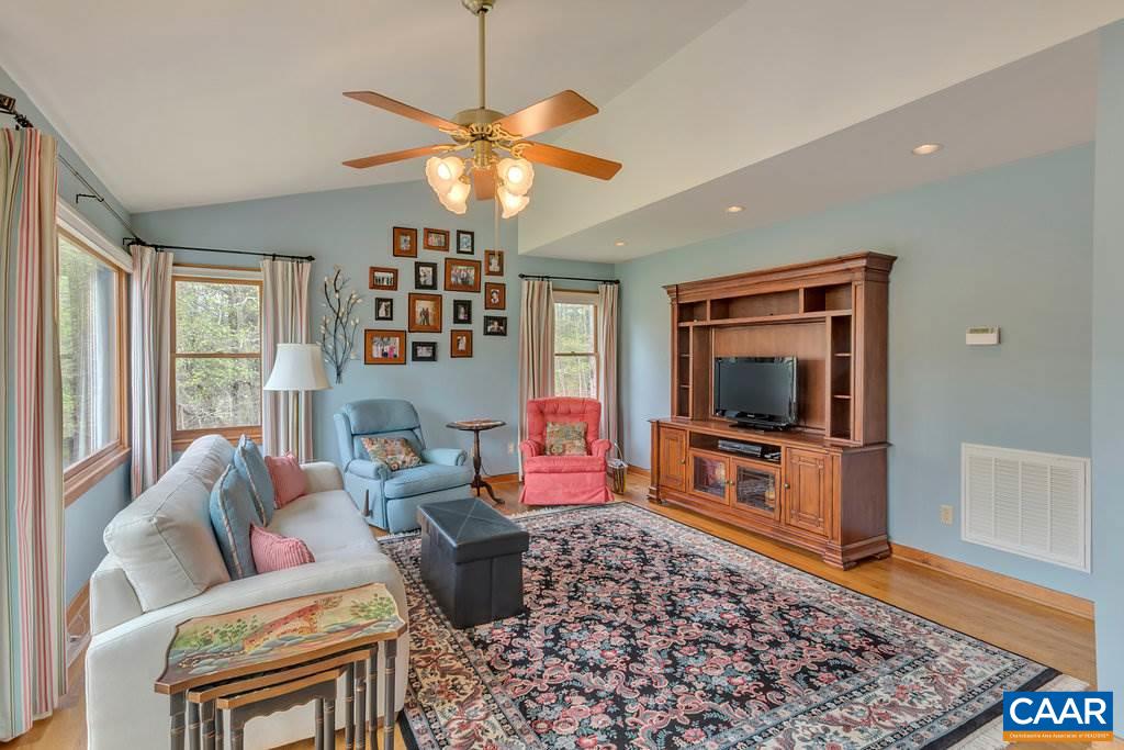 4945 Raspberry Road Crozet, VA 22932 - Photo 3 of 44 a living room with furniture and a flat screen tv