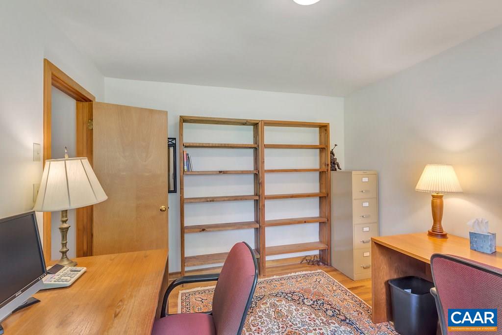 4945 Raspberry Road Crozet, VA 22932 - Photo 8 of 44 a bedroom with a bed and a lamp