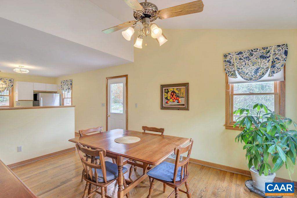 4945 Raspberry Road Crozet, VA 22932 - Photo 9 of 44 a view of a dining room with furniture and wooden floor