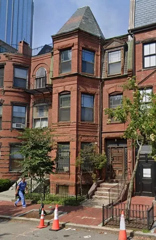 a front view of a building with street view