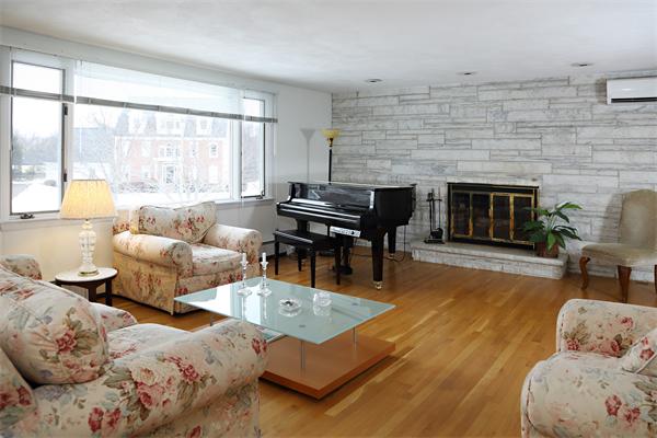 27 Battle Green Road Lexington, MA 02421 - Photo 4 of 7 a living room with furniture and a fireplace