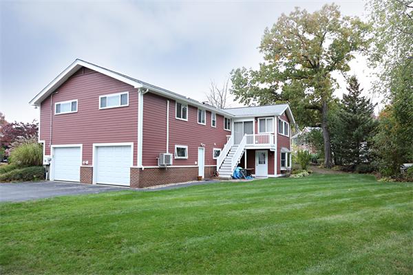 27 Battle Green Road Lexington, MA 02421 - Photo 6 of 7 a front view of a house with a yard and trees