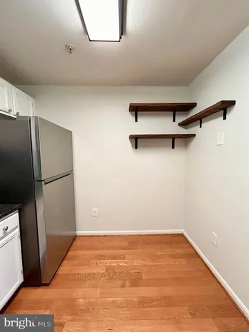 a bathroom with a sink vanity mirror and toilet