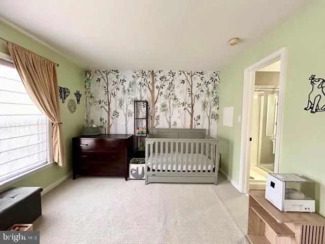 a view of a hallway with wooden shelves